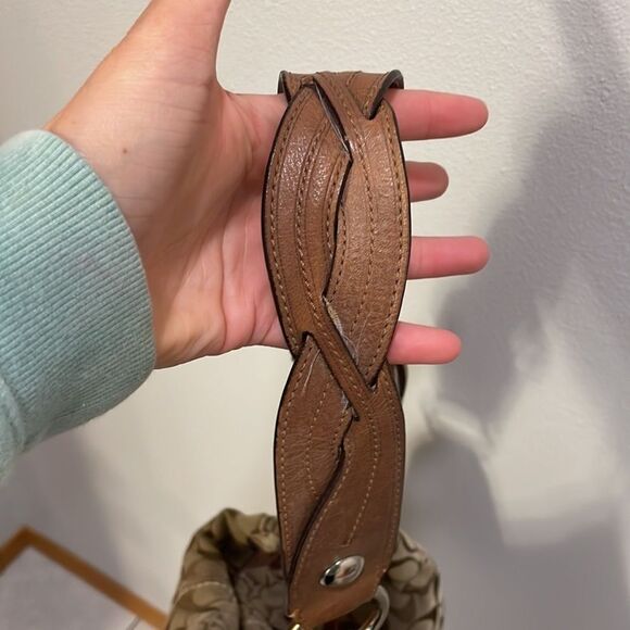 Coach woman’s brown canvas with twisted brown leather strap. - Picture 7 of 11
